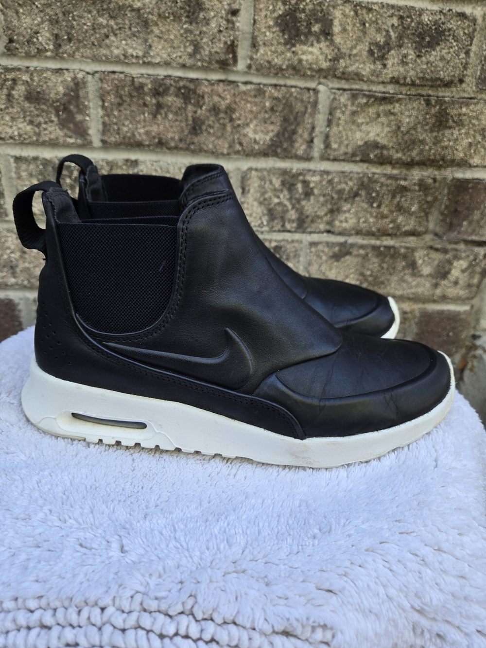 Nike Air Max Thea Mid in the Black/Sail colorway (SKU: 859550-001)